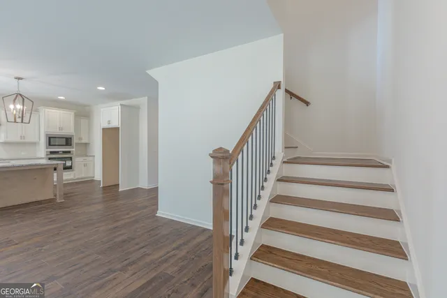 a view of an entryway with wooden floor