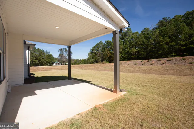 a view of a floor to ceiling window with yard