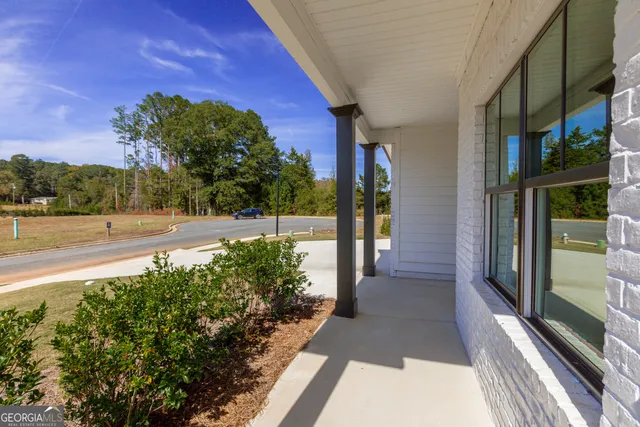 a view of a pathway both side of a house