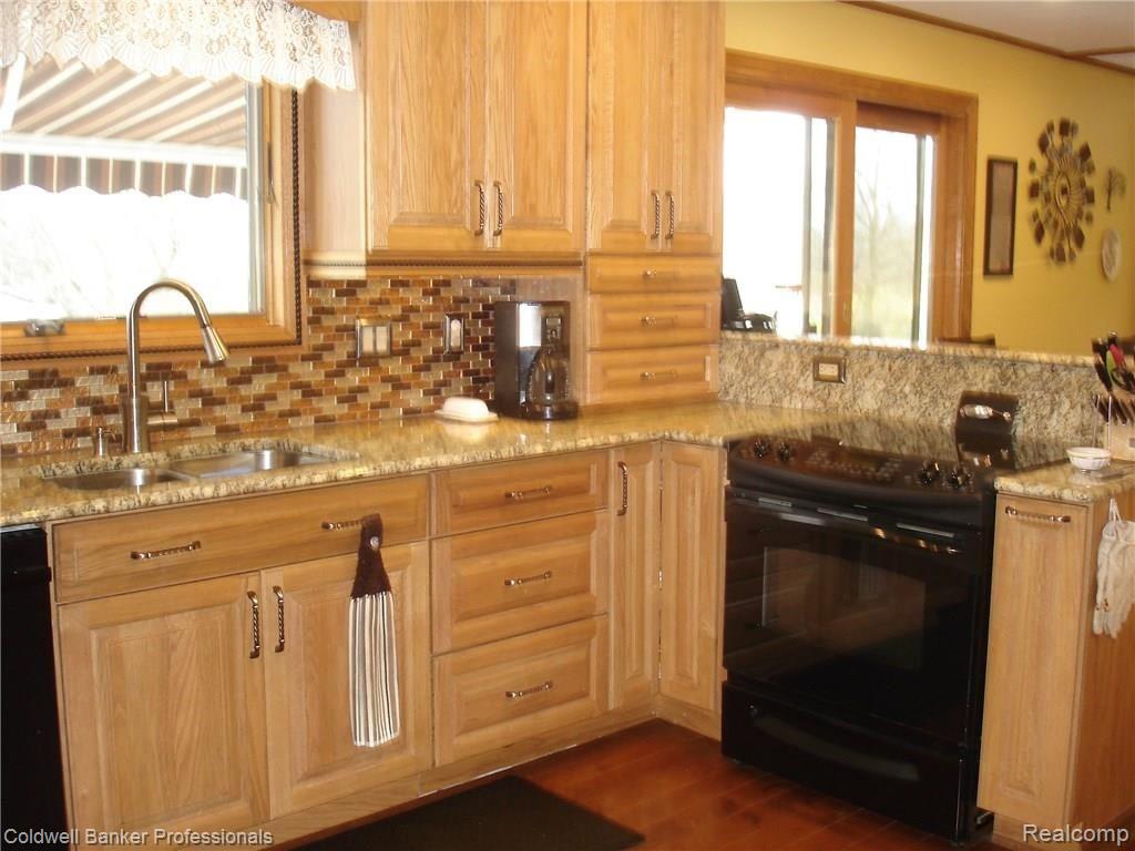 8715 Rattalee Lake Road Clarkston, MI 48348 - Photo 10 of 49 Opens to Breakfast Nook & Family Room