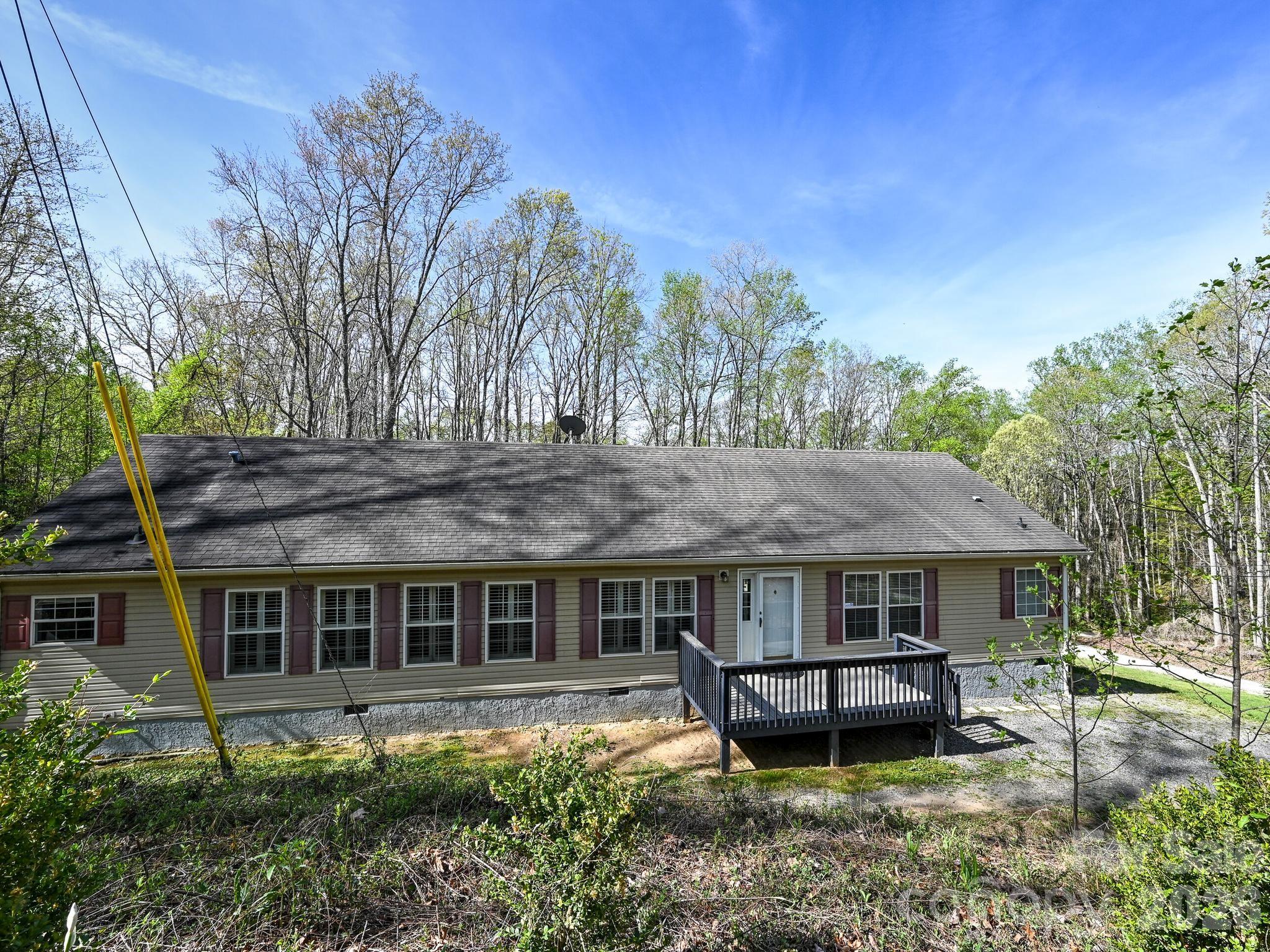 119 Laurel Haven Road Fairview, NC 28730 - Photo 1 of 33 a backyard of a house with table and chairs