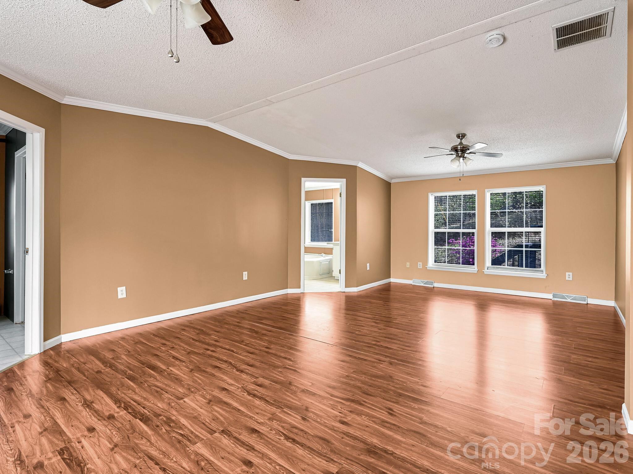 119 Laurel Haven Road Fairview, NC 28730 - Photo 13 of 33 wooden floor in an empty room with a window