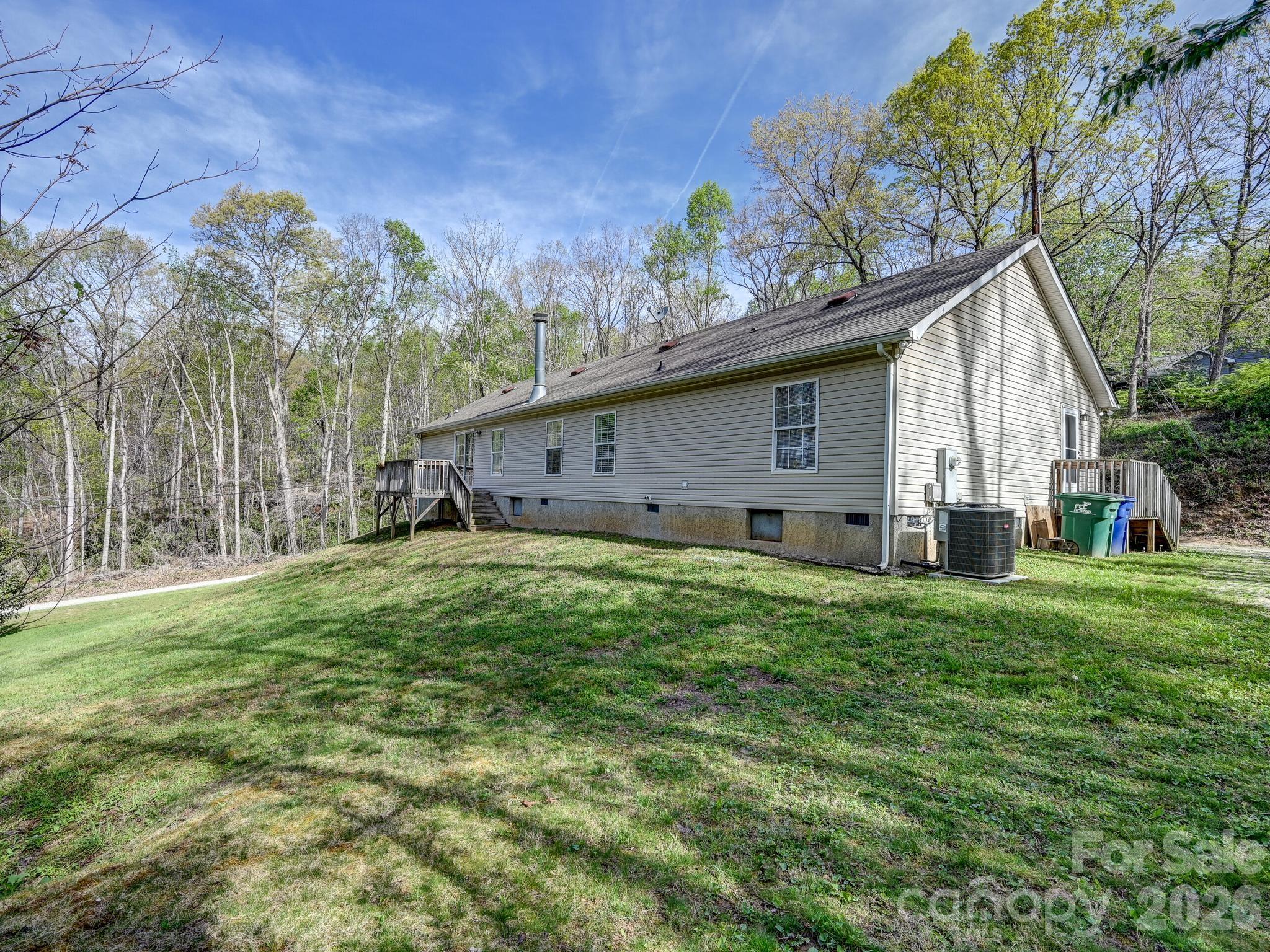 119 Laurel Haven Road Fairview, NC 28730 - Photo 31 of 33 a house view with a garden space