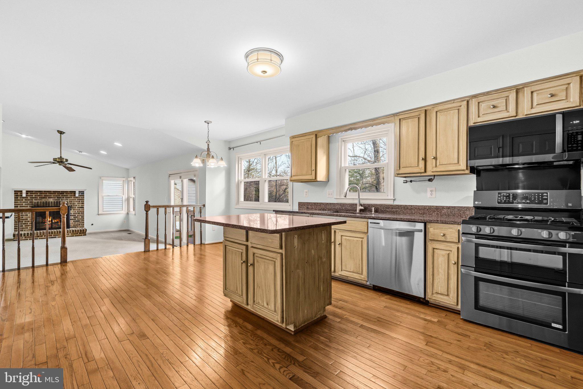 7118 Counter Place Burke, VA 22015 - Photo 14 of 53 Bright and inviting open kitchen space.
