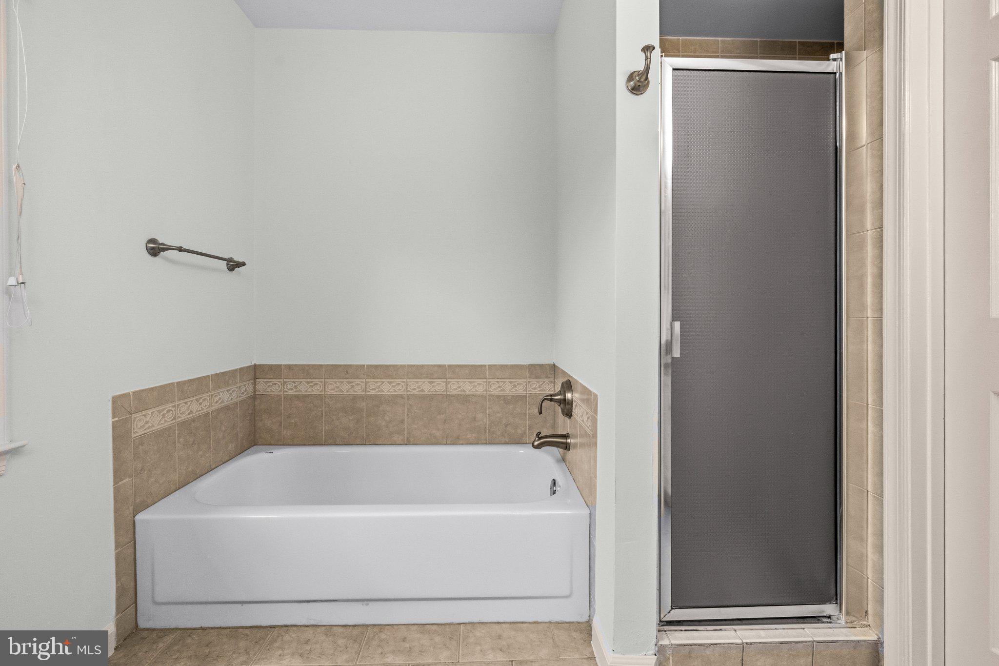 7118 Counter Place Burke, VA 22015 - Photo 38 of 53 Serene bathroom retreat with modern fixtures.