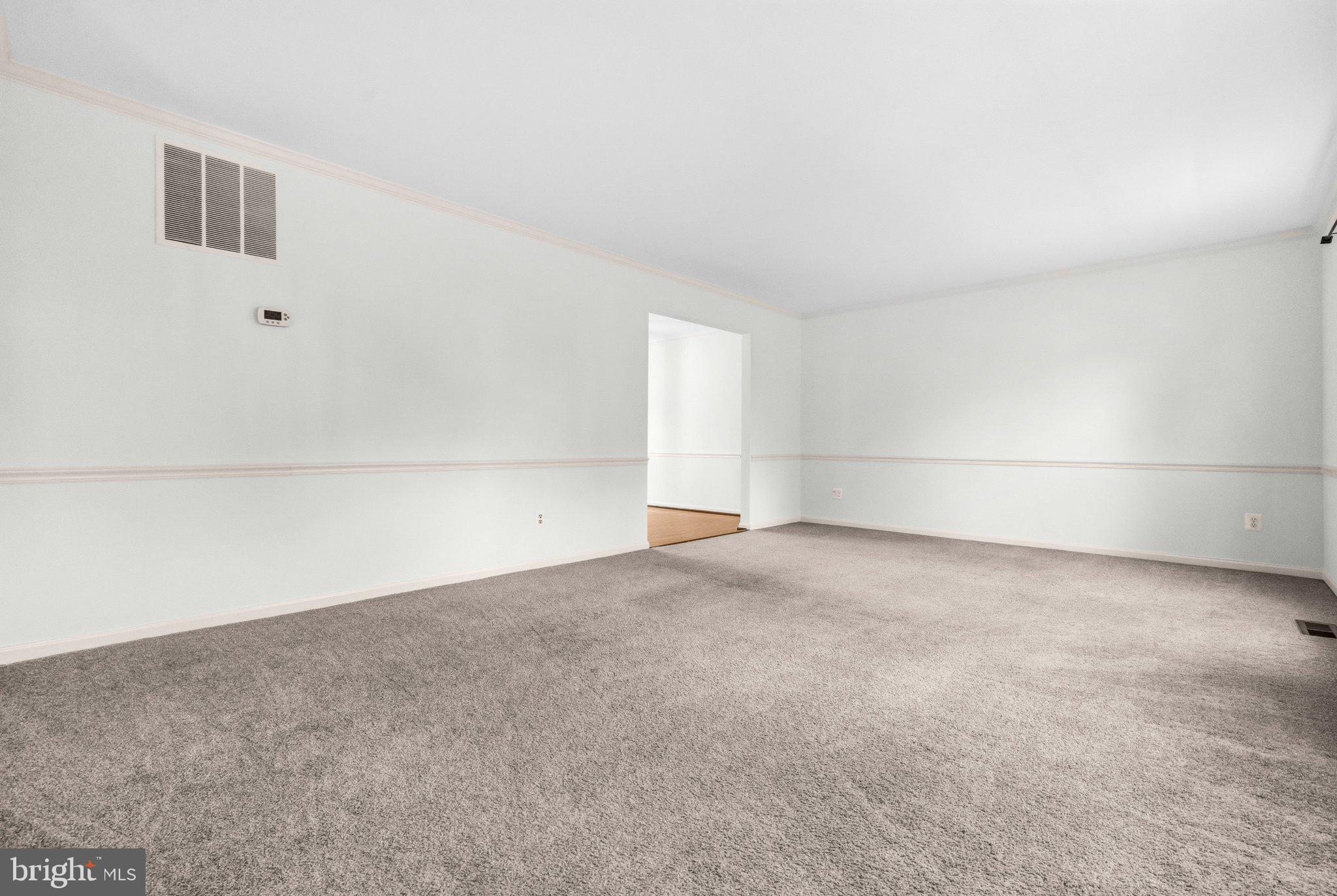 7118 Counter Place Burke, VA 22015 - Photo 8 of 53 Spacious, light-filled living area.