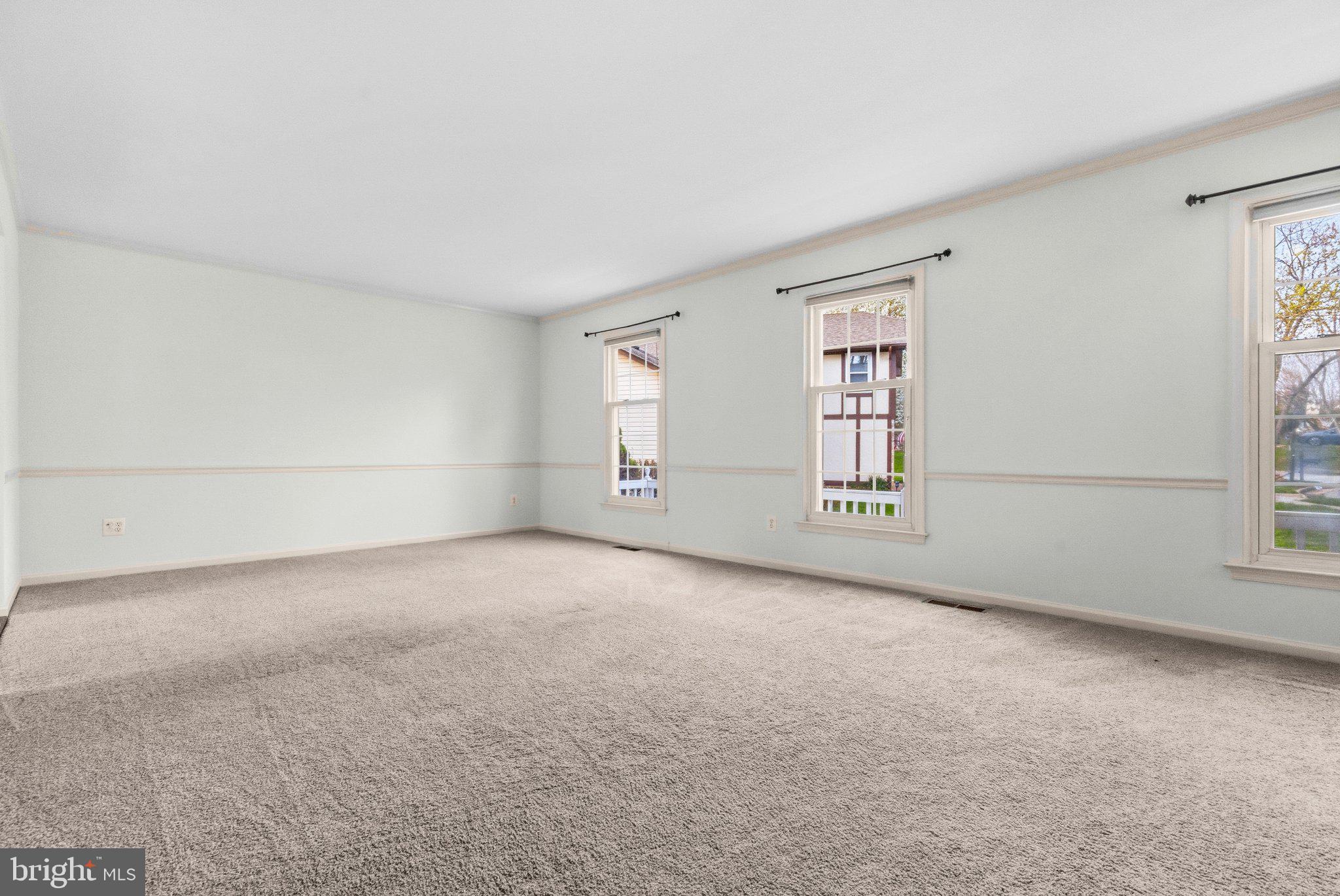 7118 Counter Place Burke, VA 22015 - Photo 9 of 53 Spacious, light-filled living area.