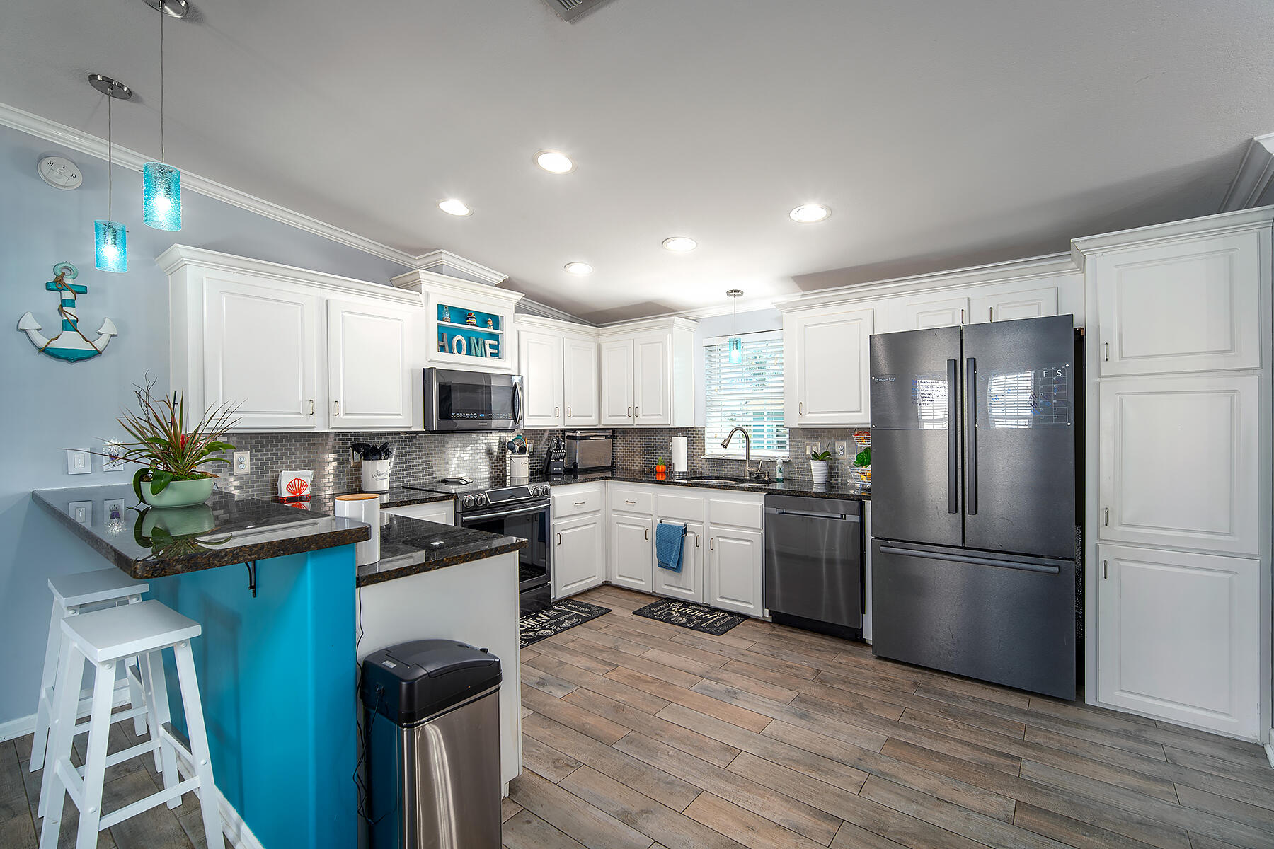 10 Riviera Drive Key West, FL 33040 - Photo 11 of 49 a kitchen with a sink stainless steel appliances and cabinets
