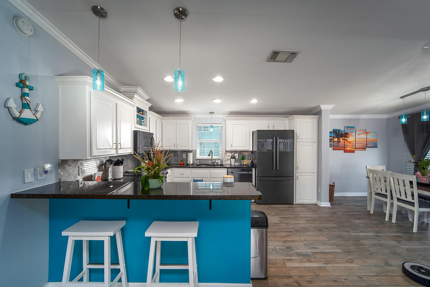 10 Riviera Drive Key West, FL 33040 - Photo 13 of 49 a kitchen with refrigerator and chairs