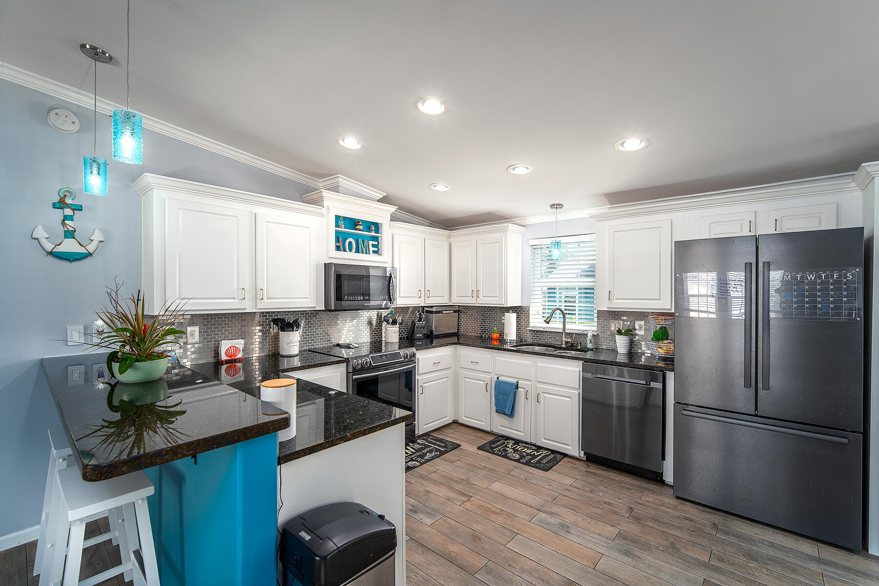 10 Riviera Drive Key West, FL 33040 - Photo 14 of 49 a kitchen with stainless steel appliances granite countertop a sink stove and refrigerator