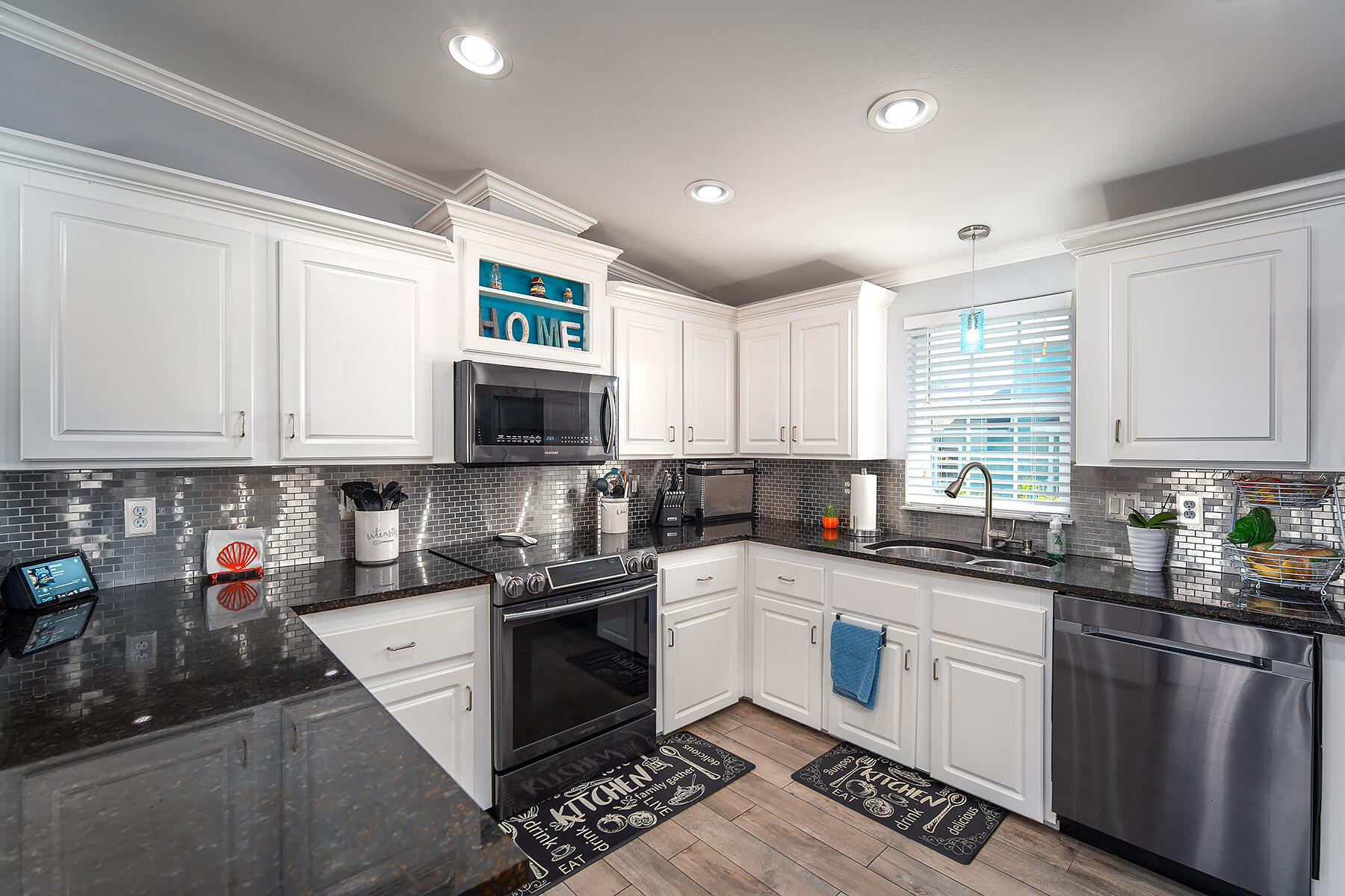10 Riviera Drive Key West, FL 33040 - Photo 15 of 49 a kitchen with stainless steel appliances granite countertop a stove a sink dishwasher and a microwave