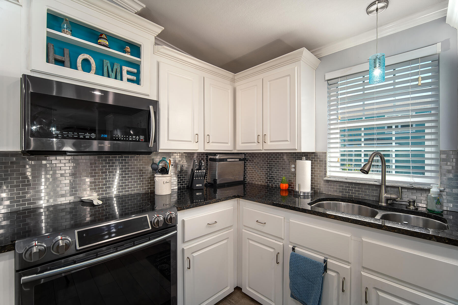 10 Riviera Drive Key West, FL 33040 - Photo 16 of 49 a kitchen with stainless steel appliances a sink a stove and cabinets
