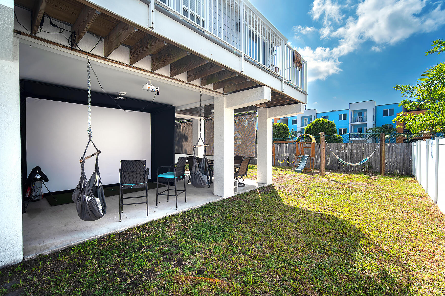10 Riviera Drive Key West, FL 33040 - Photo 39 of 49 a view of a porch with chairs and potted plants
