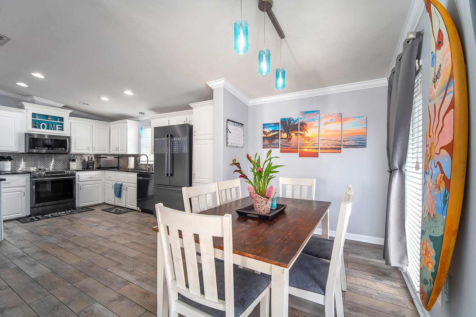 10 Riviera Drive Key West, FL 33040 - Photo 4 of 49 a view of a dining room with furniture and a kitchen