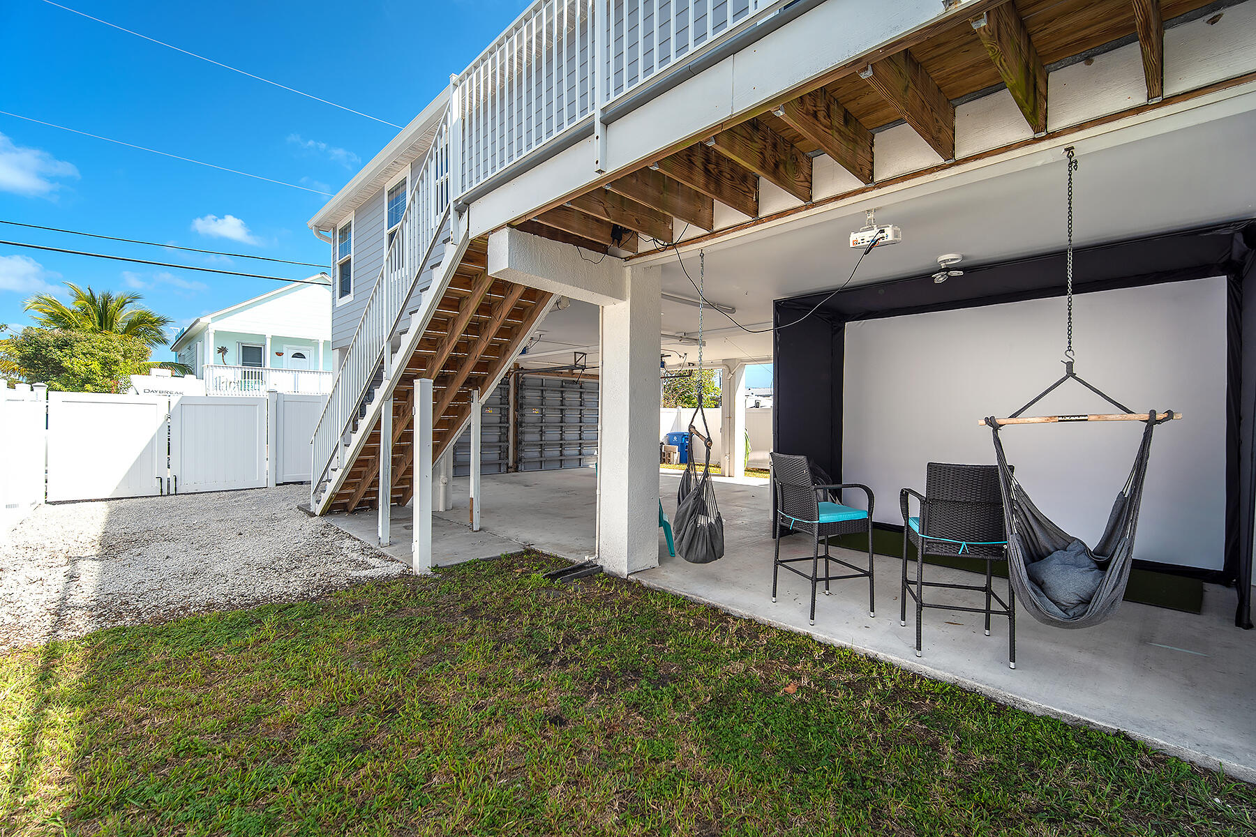 10 Riviera Drive Key West, FL 33040 - Photo 41 of 49 a view of staircase with furniture and a chandelier