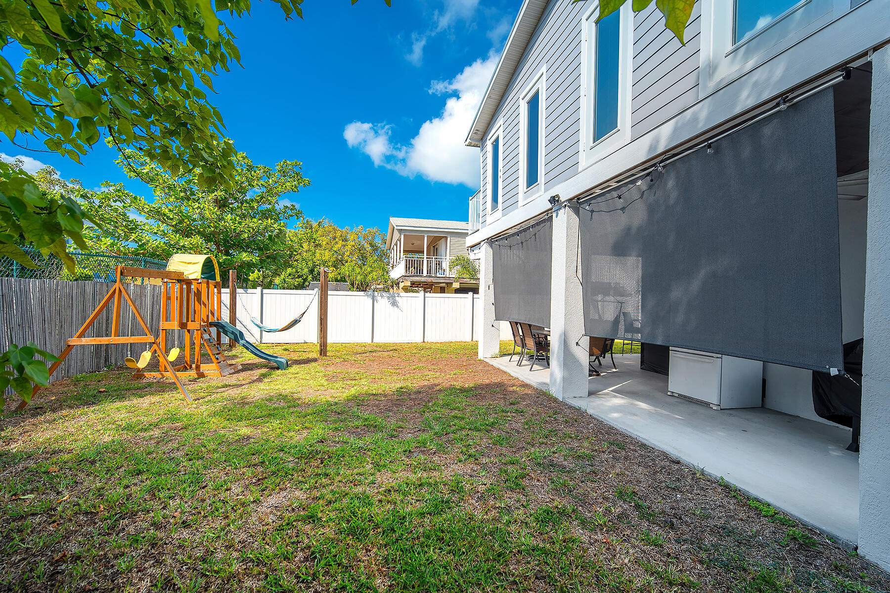 10 Riviera Drive Key West, FL 33040 - Photo 47 of 49 a view of backyard with a patio and a slide