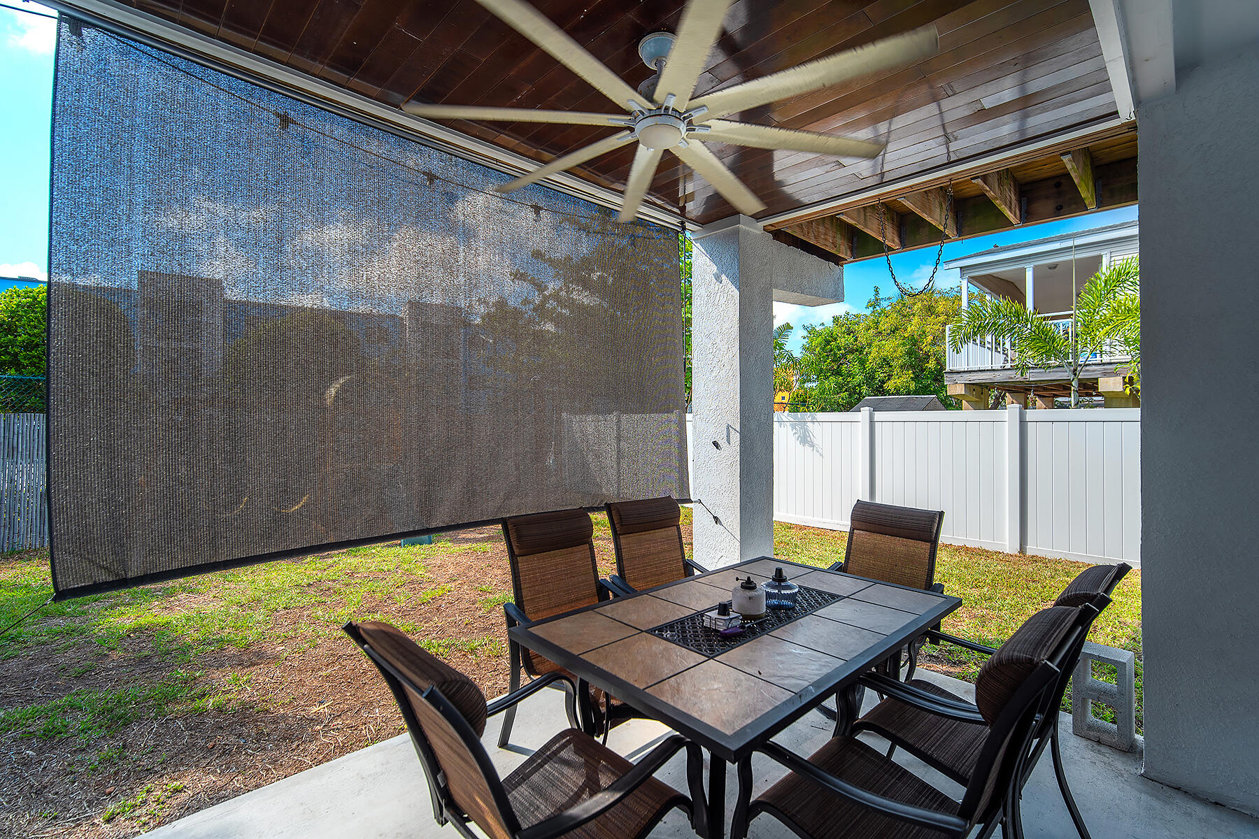 10 Riviera Drive Key West, FL 33040 - Photo 48 of 49 a backyard of a house with table and chairs