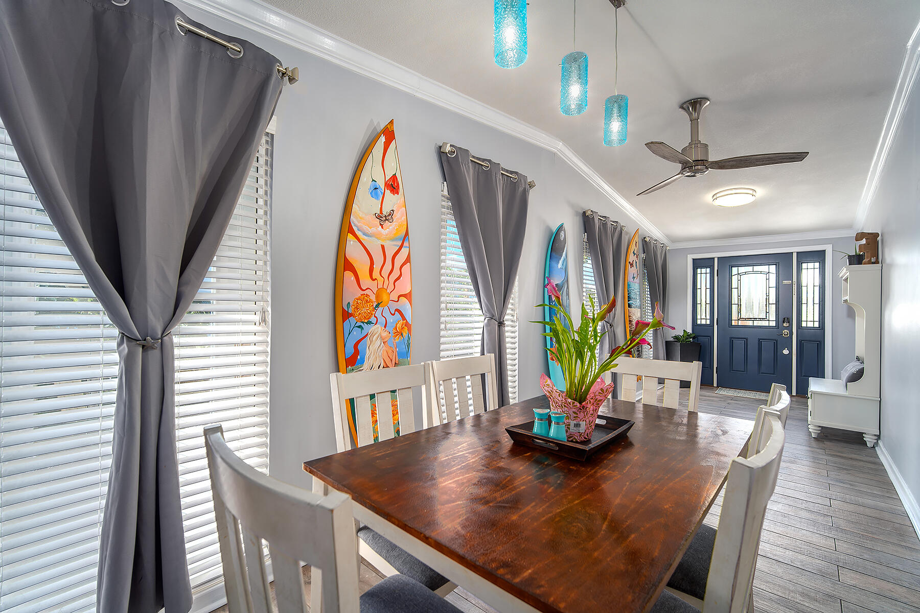 10 Riviera Drive Key West, FL 33040 - Photo 8 of 49 a view of a dining room with furniture a chandelier and wooden floor