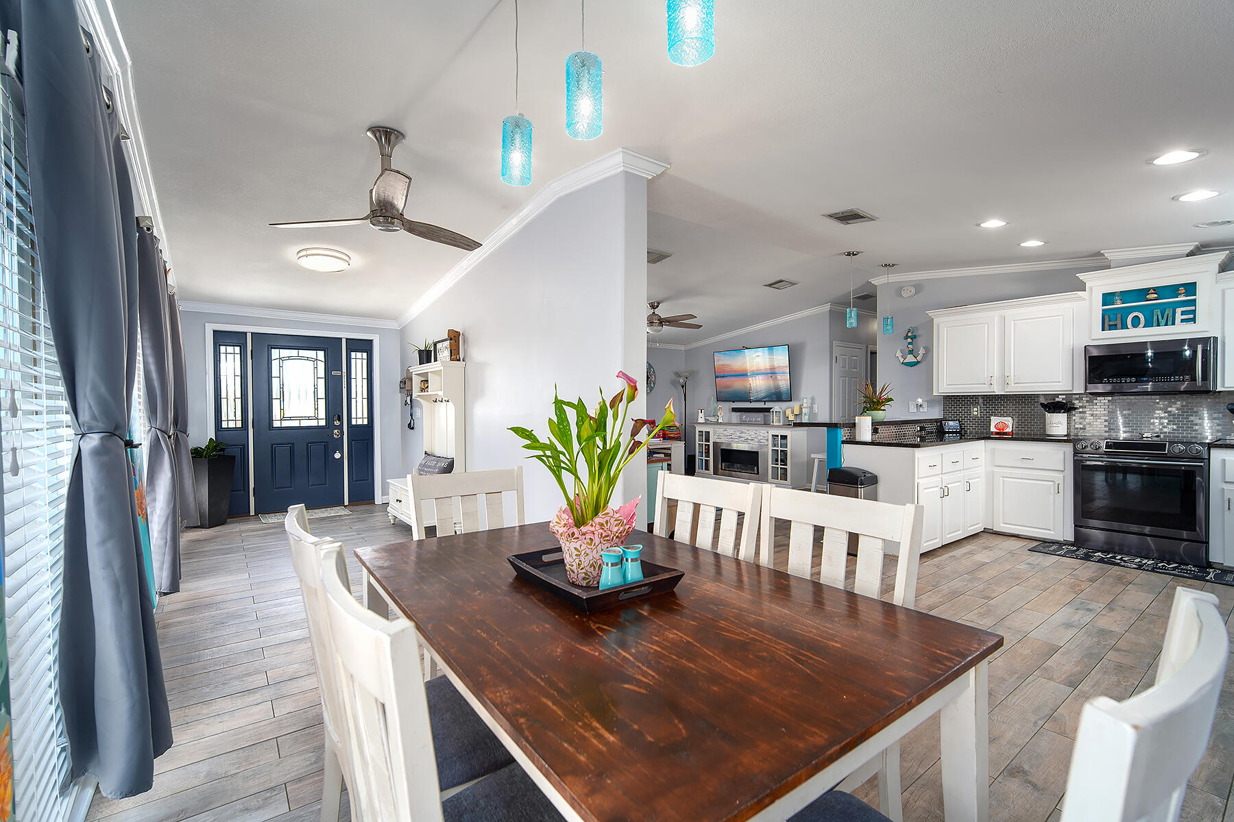 10 Riviera Drive Key West, FL 33040 - Photo 9 of 49 a kitchen with a dining table chairs and refrigerator