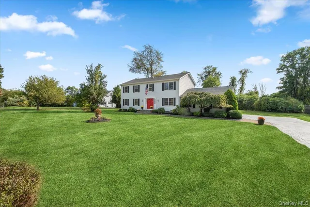 an aerial view of residential house with outdoor space and lake view