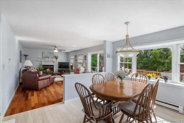 a view of a dining room with furniture window and outside view