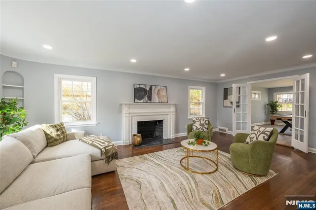 a living room with fireplace furniture and a fireplace