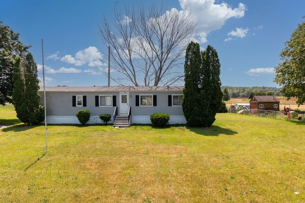 1039 Main Street Acushnet, MA 02743 - Photo 18 of 22 a view of a house with a yard covered with snow in front of house