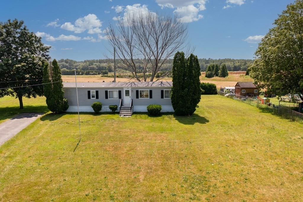 1039 Main Street Acushnet, MA 02743 - Photo 22 of 22 a view of a swimming pool with a patio and a yard