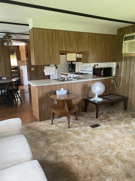 1039 Main Street Acushnet, MA 02743 - Photo 4 of 22 a kitchen with a sink and a stove