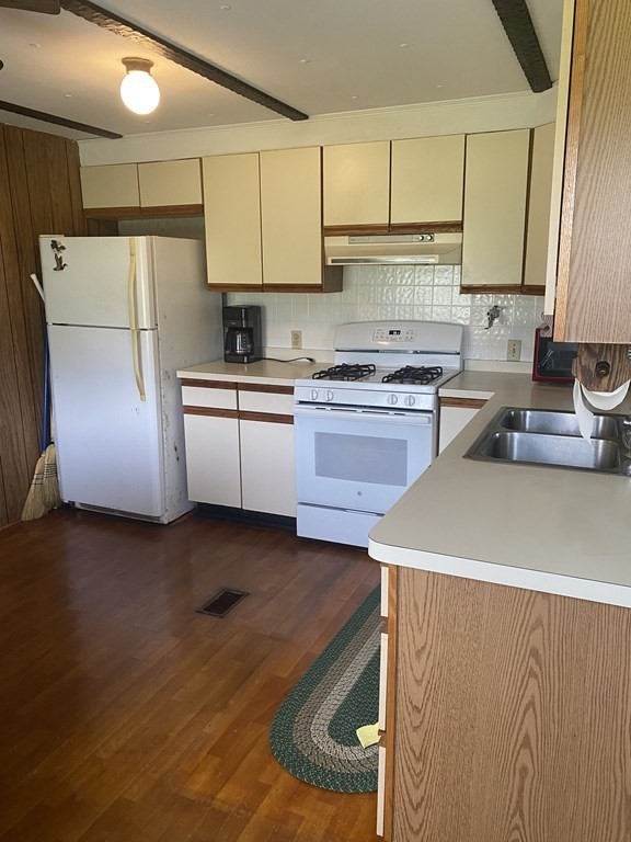 1039 Main Street Acushnet, MA 02743 - Photo 5 of 22 a kitchen with a refrigerator sink and stove
