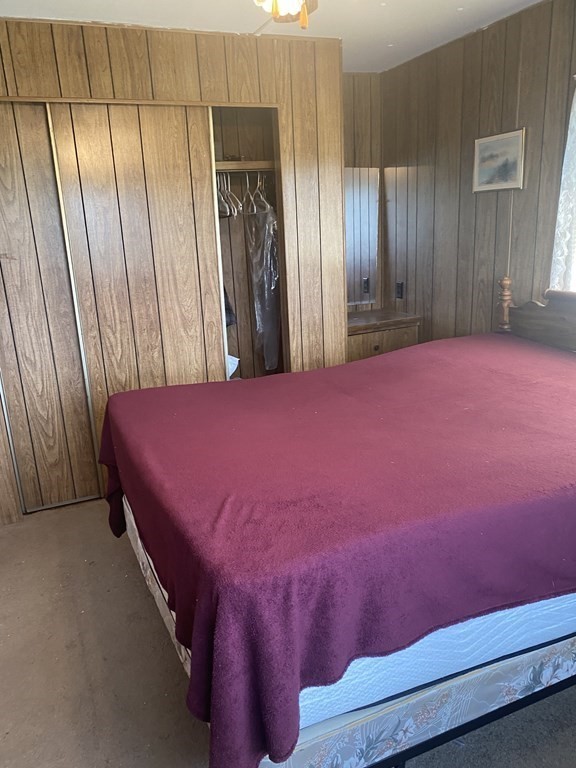 1039 Main Street Acushnet, MA 02743 - Photo 8 of 22 a bedroom with a bed and a mirror