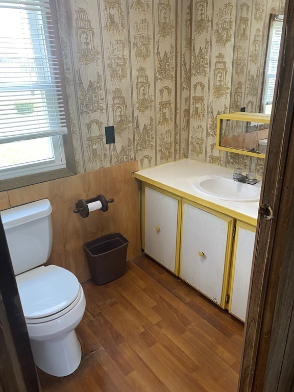 1039 Main Street Acushnet, MA 02743 - Photo 9 of 22 a bathroom with a granite countertop toilet sink and mirror