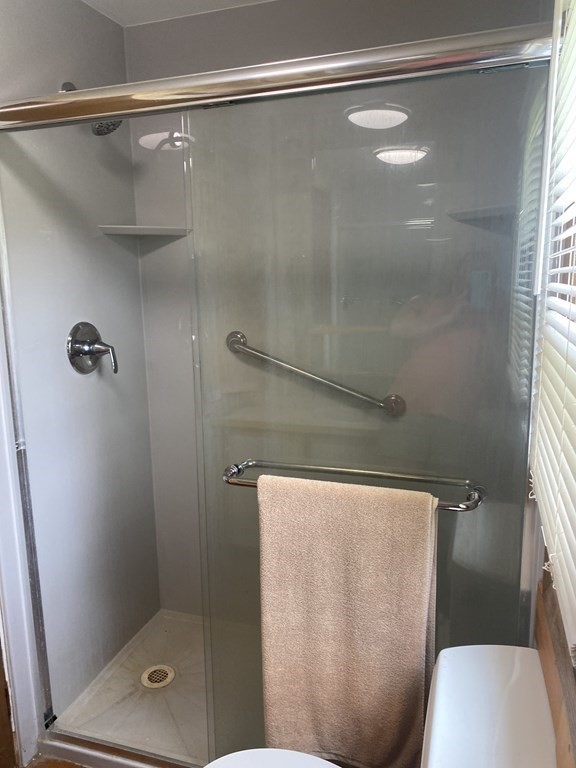 1039 Main Street Acushnet, MA 02743 - Photo 10 of 22 a bathroom with a shower and a toilet