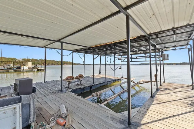 a view of a room with wooden floor and a window
