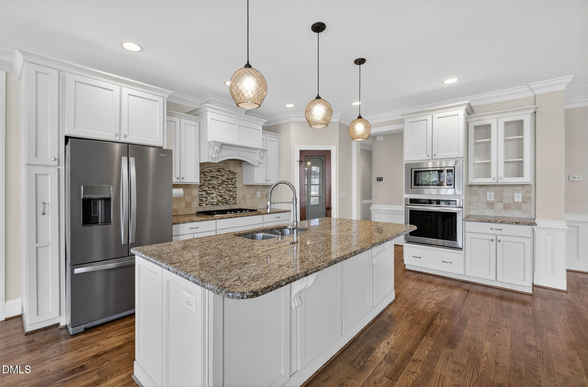 2700 Eastern Star Circle Rolesville, NC 27571 - Photo 11 of 75 a kitchen with stainless steel appliances granite countertop a refrigerator a oven and a kitchen island