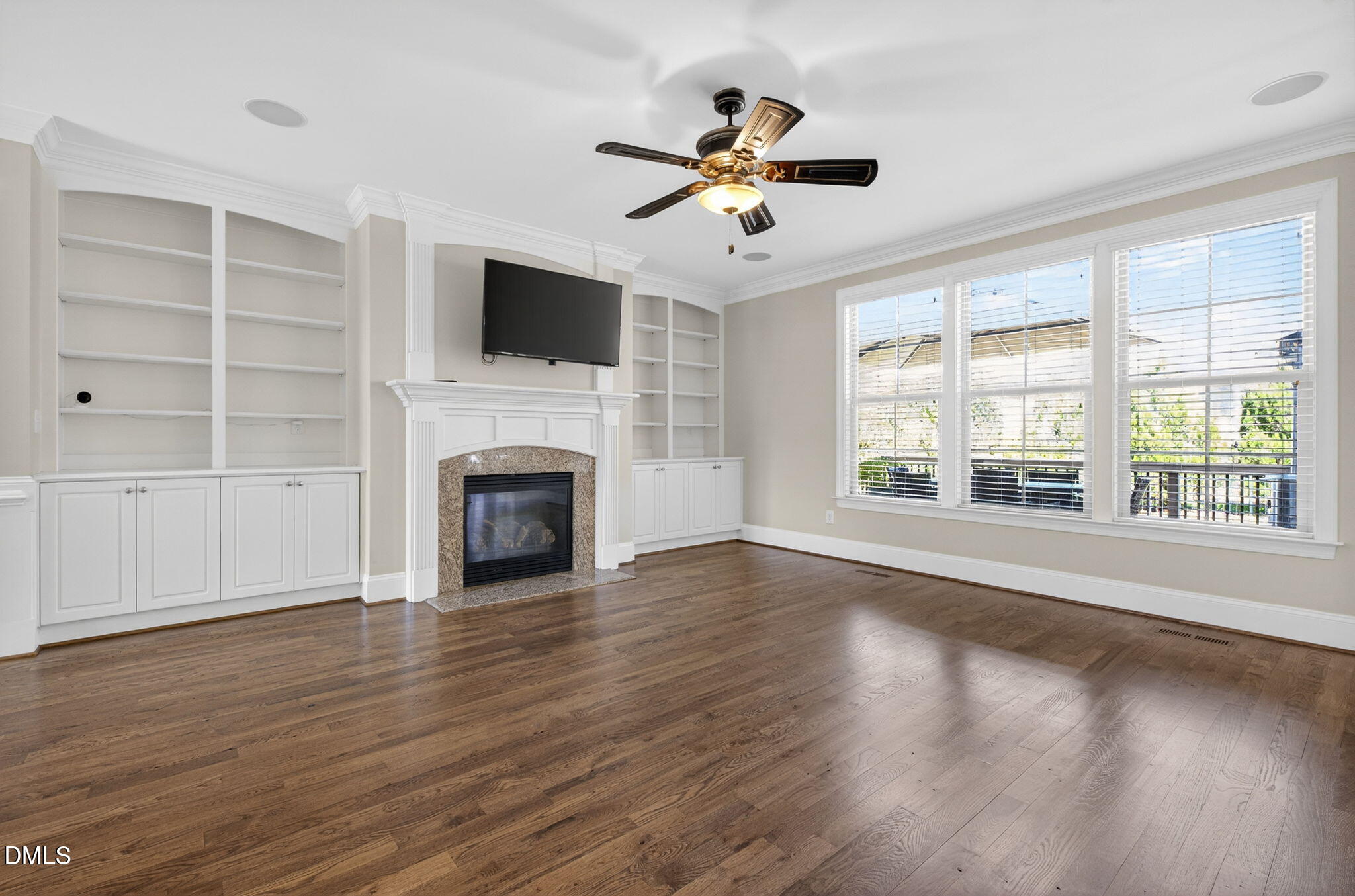 2700 Eastern Star Circle Rolesville, NC 27571 - Photo 17 of 75 a view of an empty room with wooden floor fireplace and a window