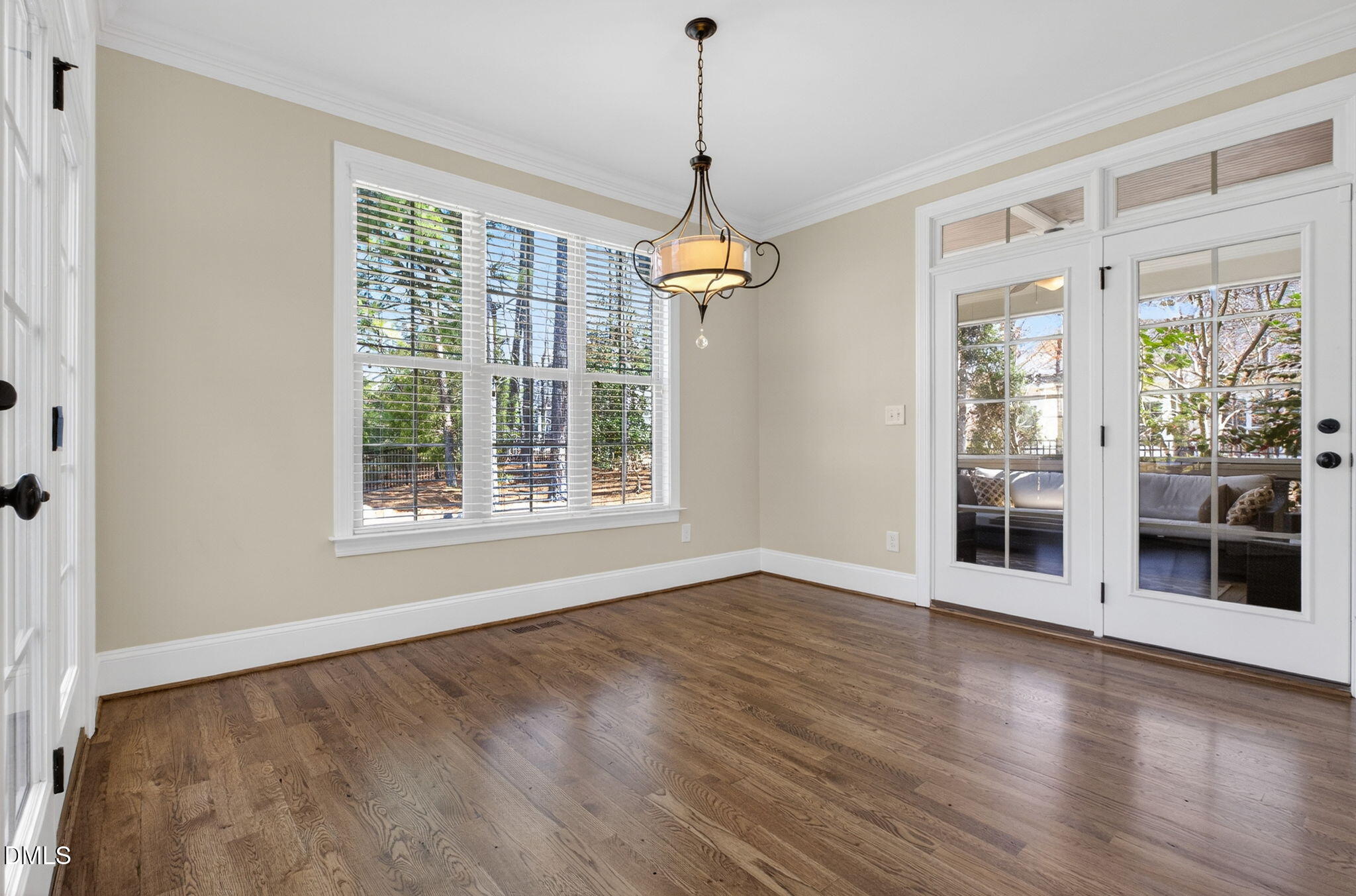2700 Eastern Star Circle Rolesville, NC 27571 - Photo 20 of 75 a view of an empty room with wooden floor and a window