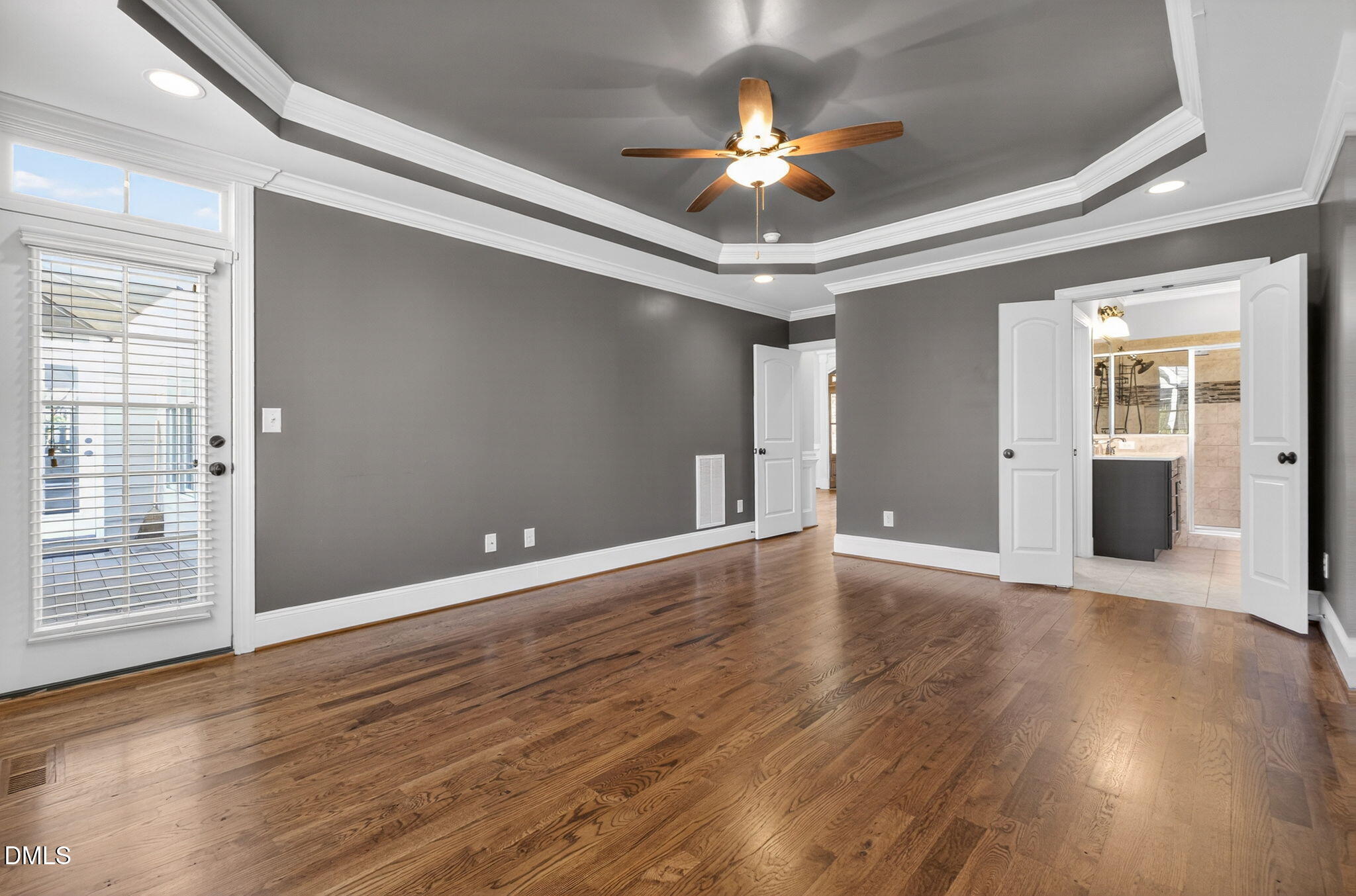 2700 Eastern Star Circle Rolesville, NC 27571 - Photo 23 of 75 a view of an empty room with wooden floor and a window