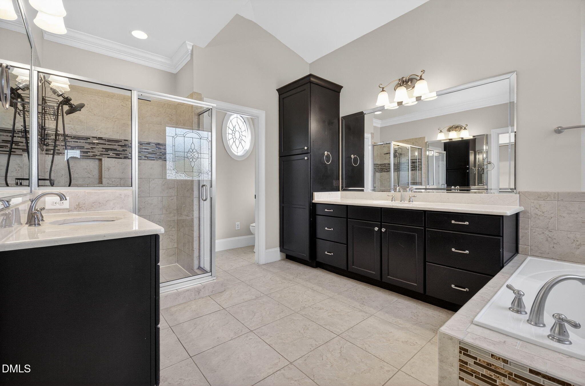 2700 Eastern Star Circle Rolesville, NC 27571 - Photo 26 of 75 a bathroom with a sink double vanity granite tub shower and a mirror