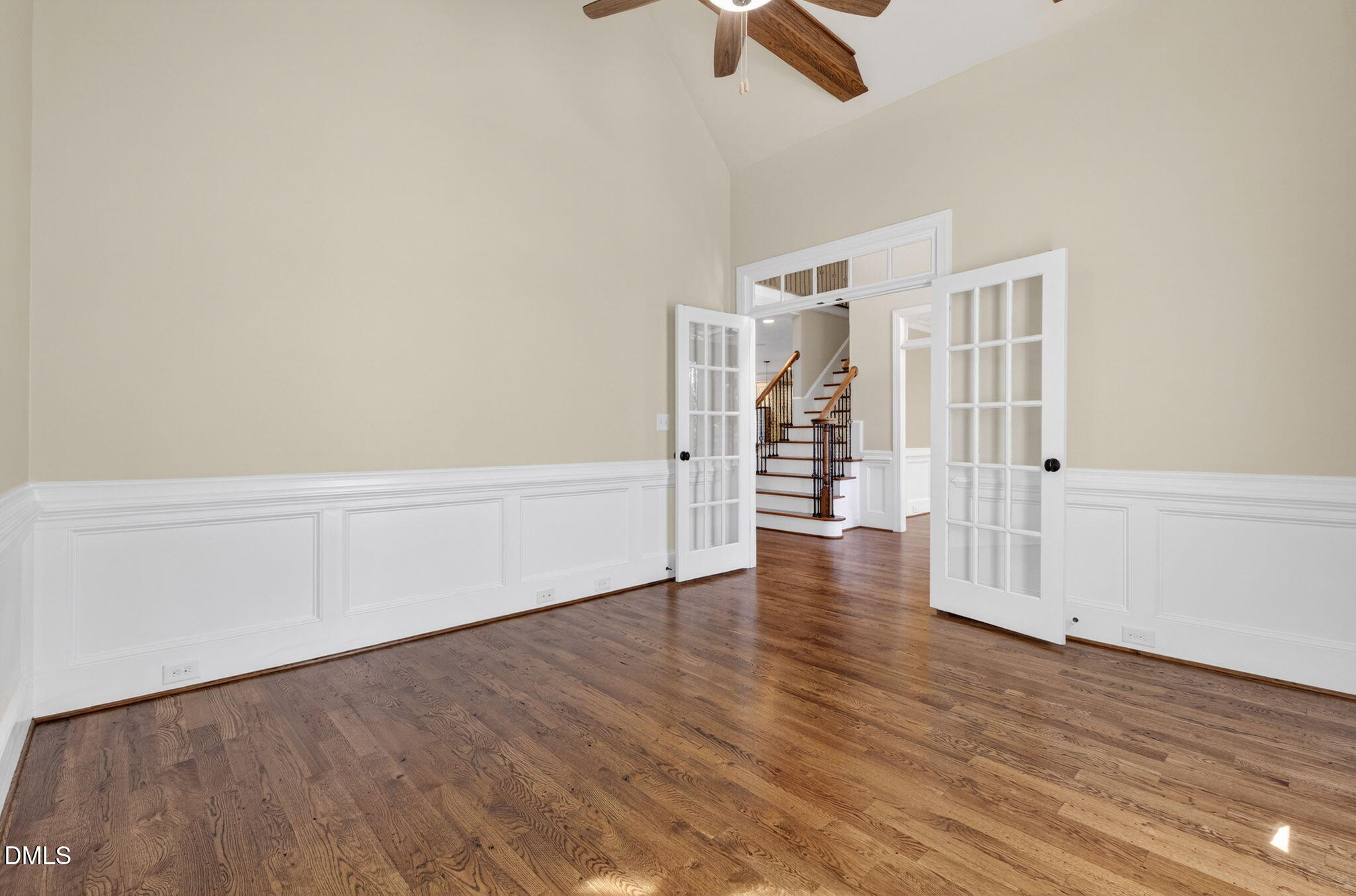 2700 Eastern Star Circle Rolesville, NC 27571 - Photo 34 of 75 an empty room with wooden floor white walls and windows