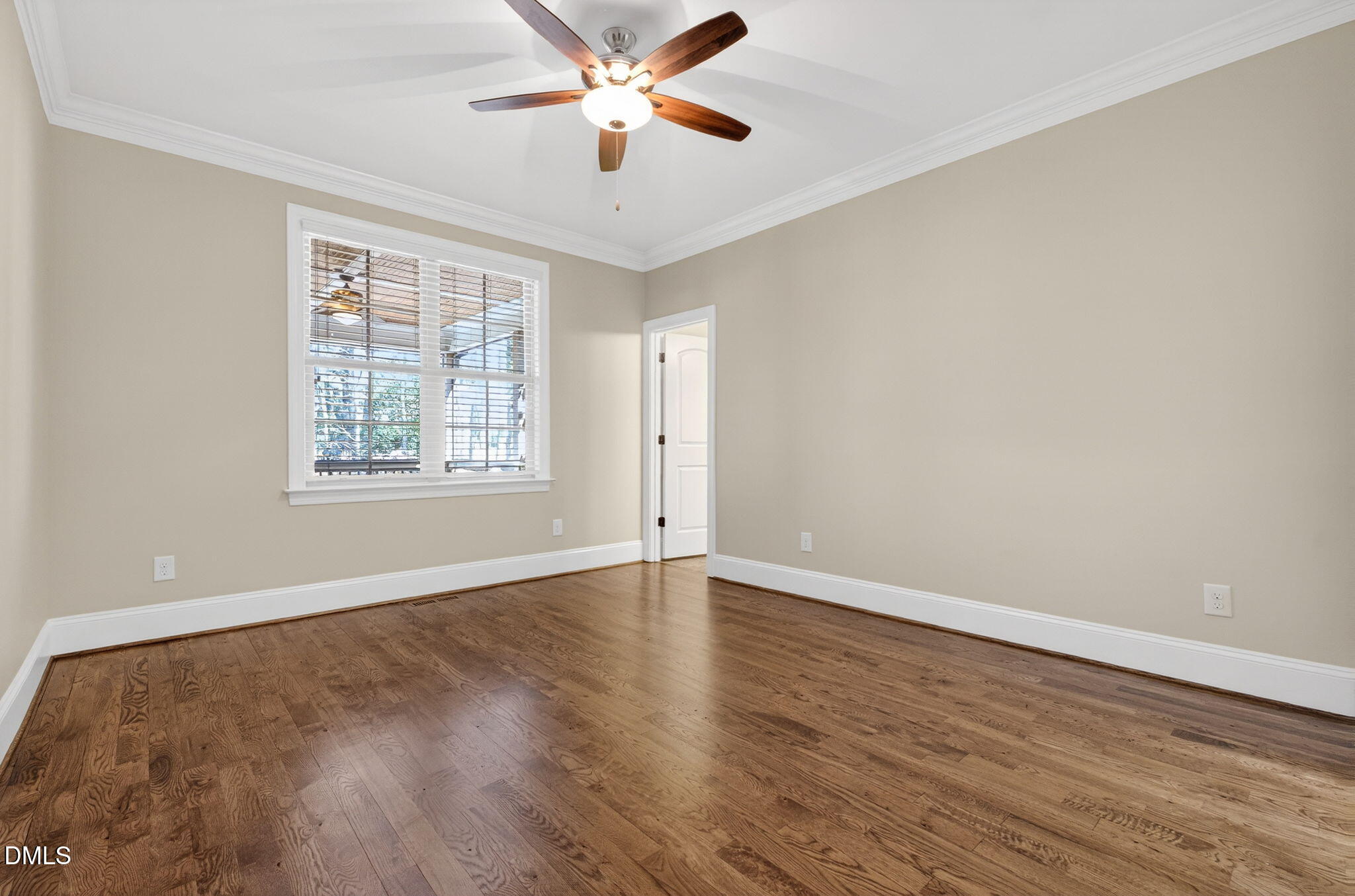 2700 Eastern Star Circle Rolesville, NC 27571 - Photo 39 of 75 an empty room with wooden floor chandelier fan and windows