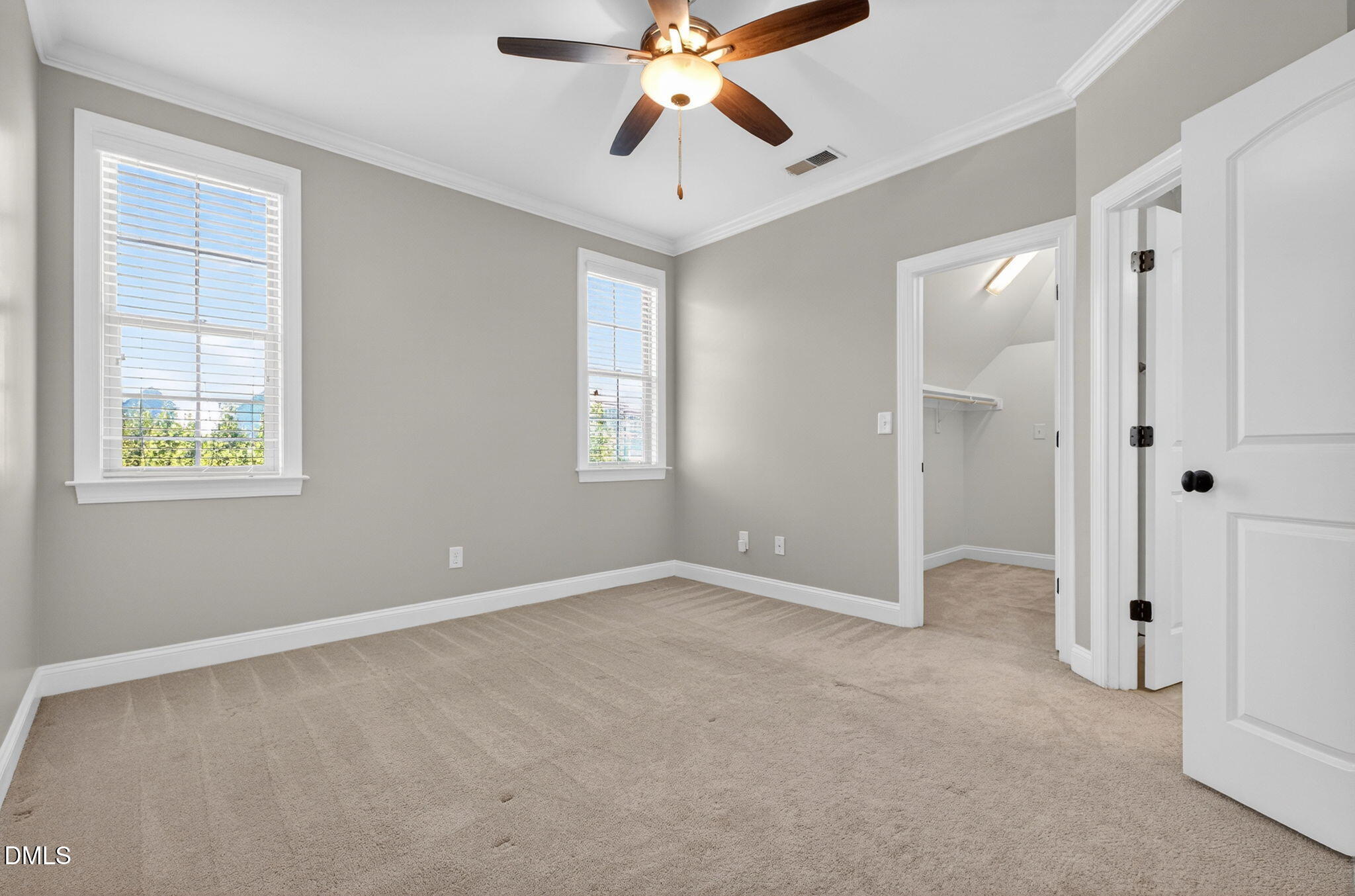 2700 Eastern Star Circle Rolesville, NC 27571 - Photo 44 of 75 a view of an empty room with window and chandelier fan