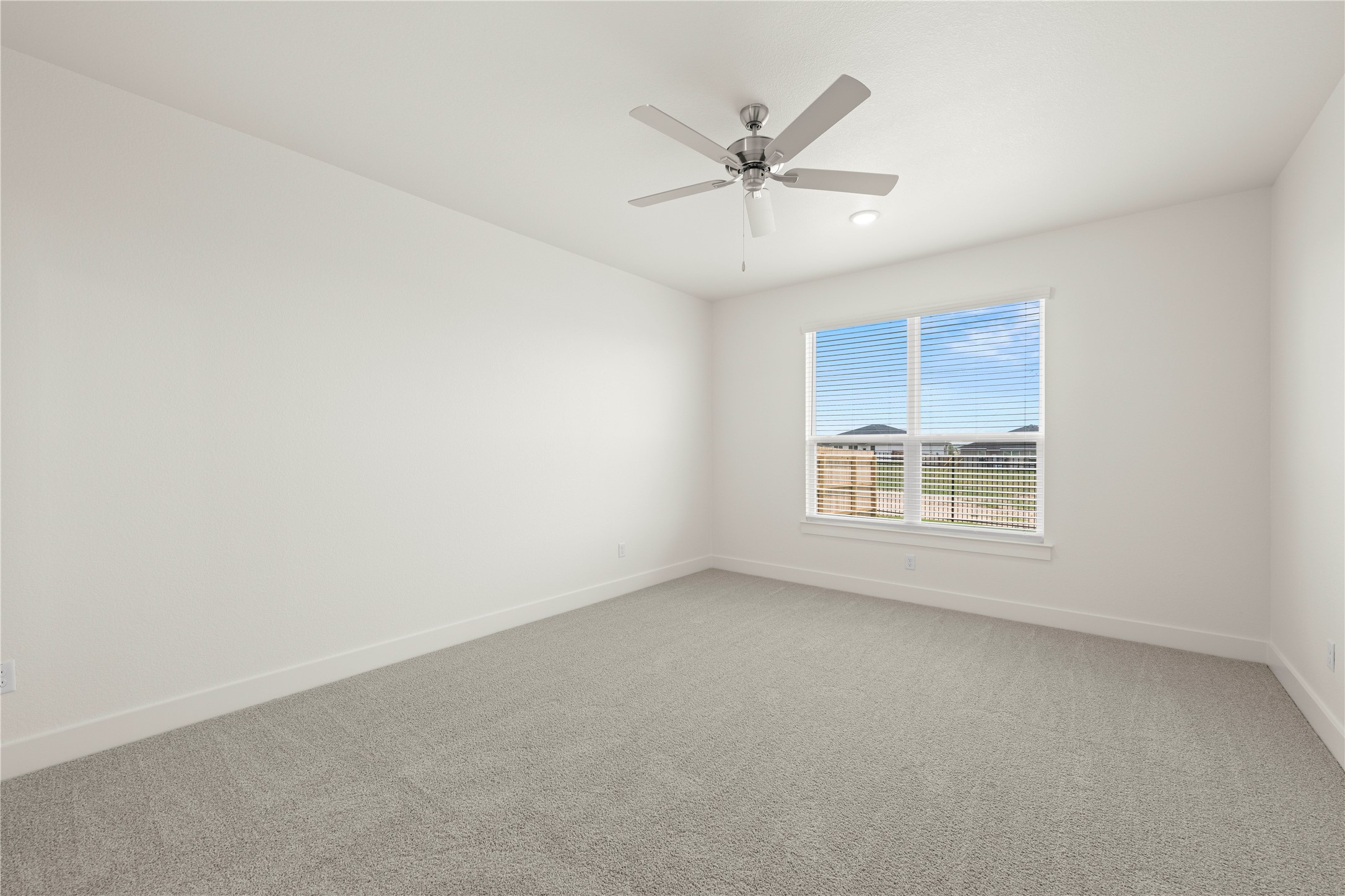 564 Gus Loop Georgetown, TX 78626 - Photo 13 of 32 an empty room with a window and a fan