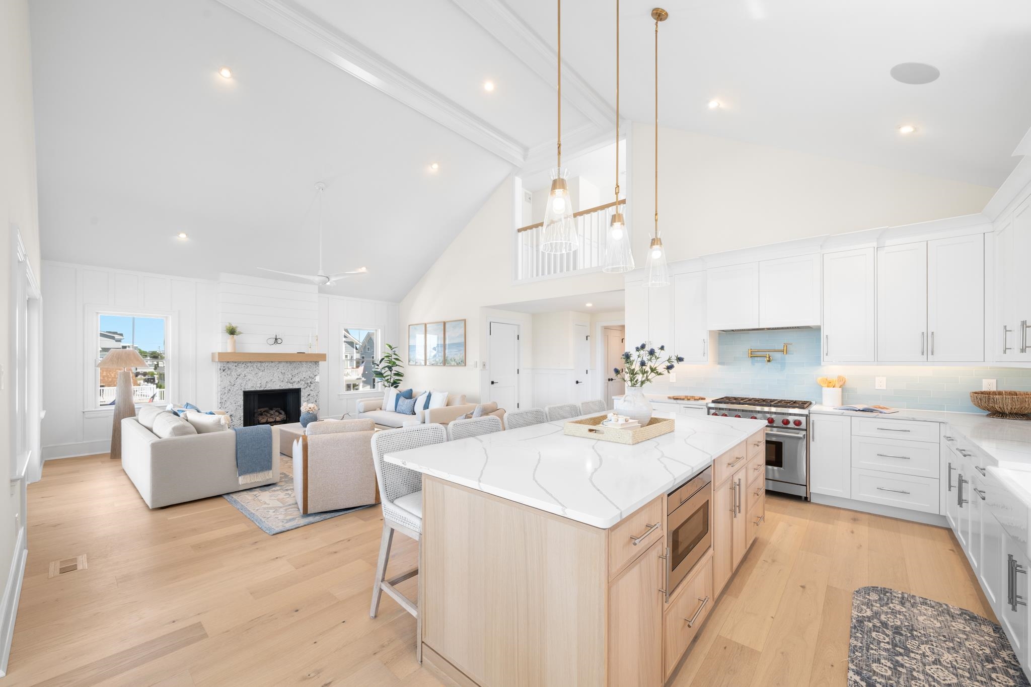 188 34th Street Avalon, NJ 08202 - Photo 14 of 47 a kitchen with a stove a sink a kitchen island with wooden cabinets