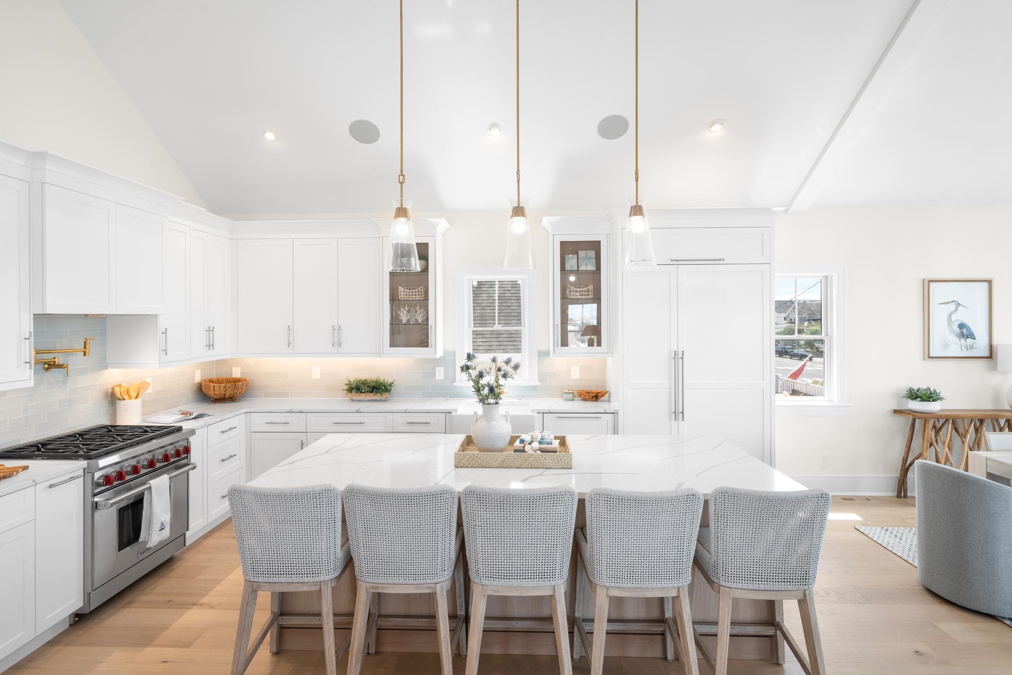 188 34th Street Avalon, NJ 08202 - Photo 17 of 47 a kitchen with stainless steel appliances kitchen island granite countertop a table chairs and a refrigerator