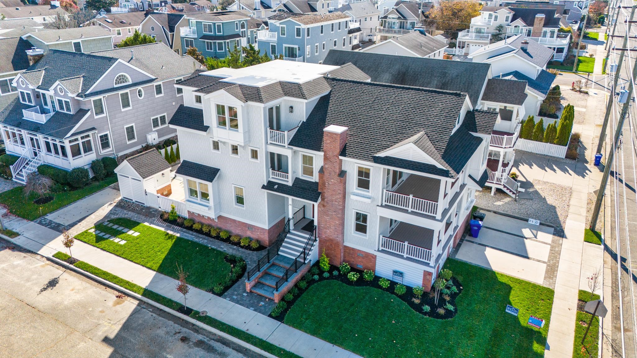 188 34th Street Avalon, NJ 08202 - Photo 3 of 47 an aerial view of multiple houses with yard