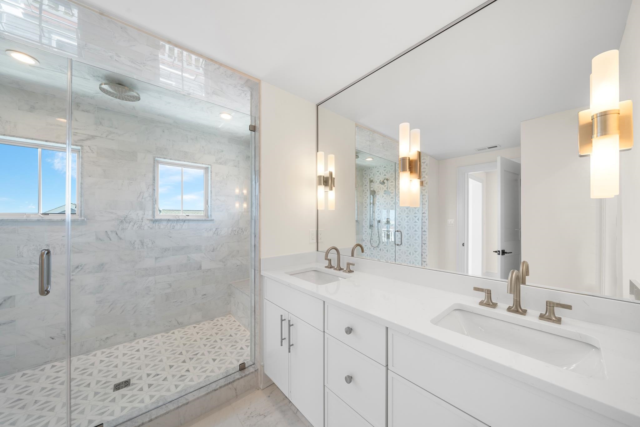 188 34th Street Avalon, NJ 08202 - Photo 43 of 47 a bathroom with a double vanity sink mirror and shower