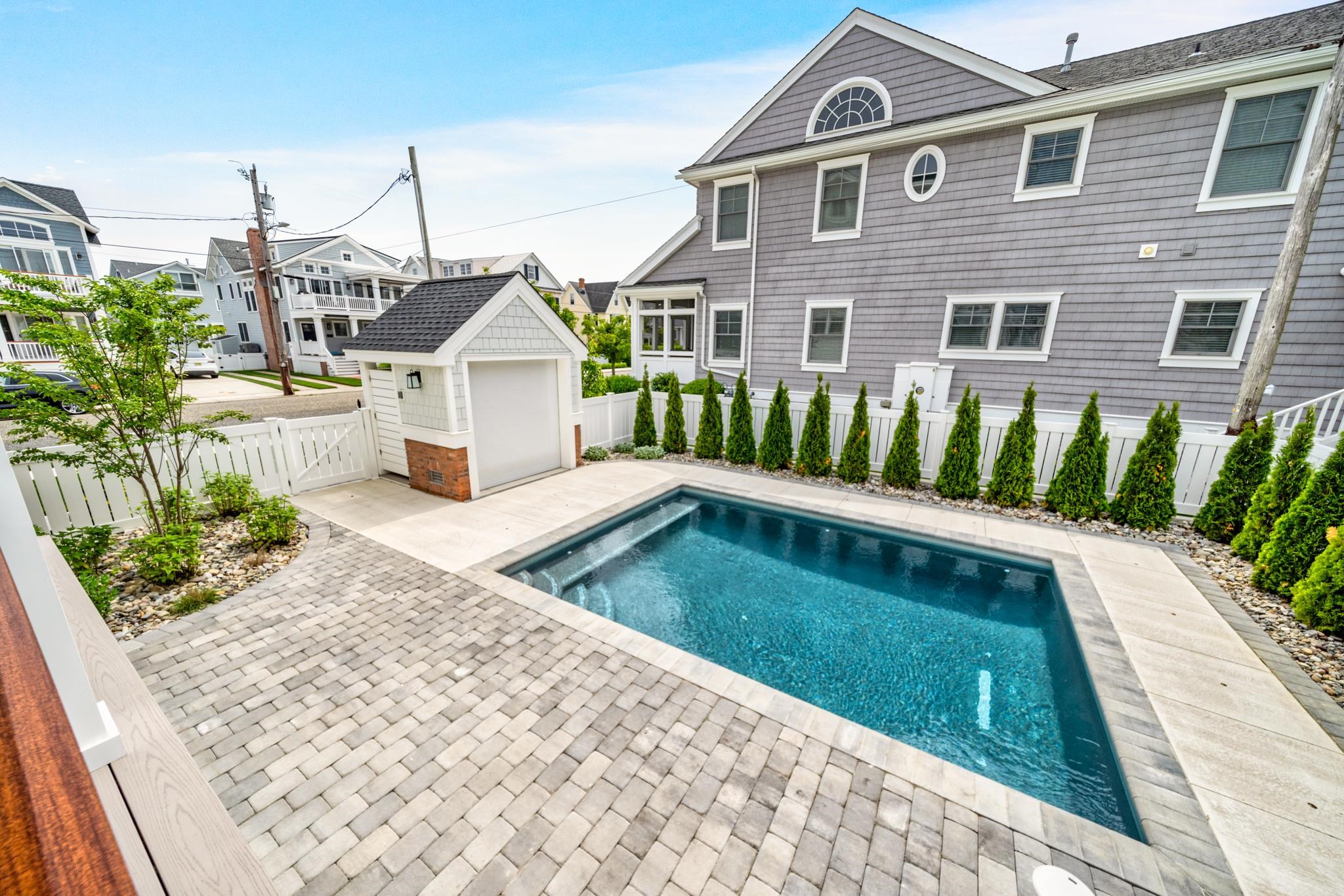 188 34th Street Avalon, NJ 08202 - Photo 9 of 47 a front view of a house with garden