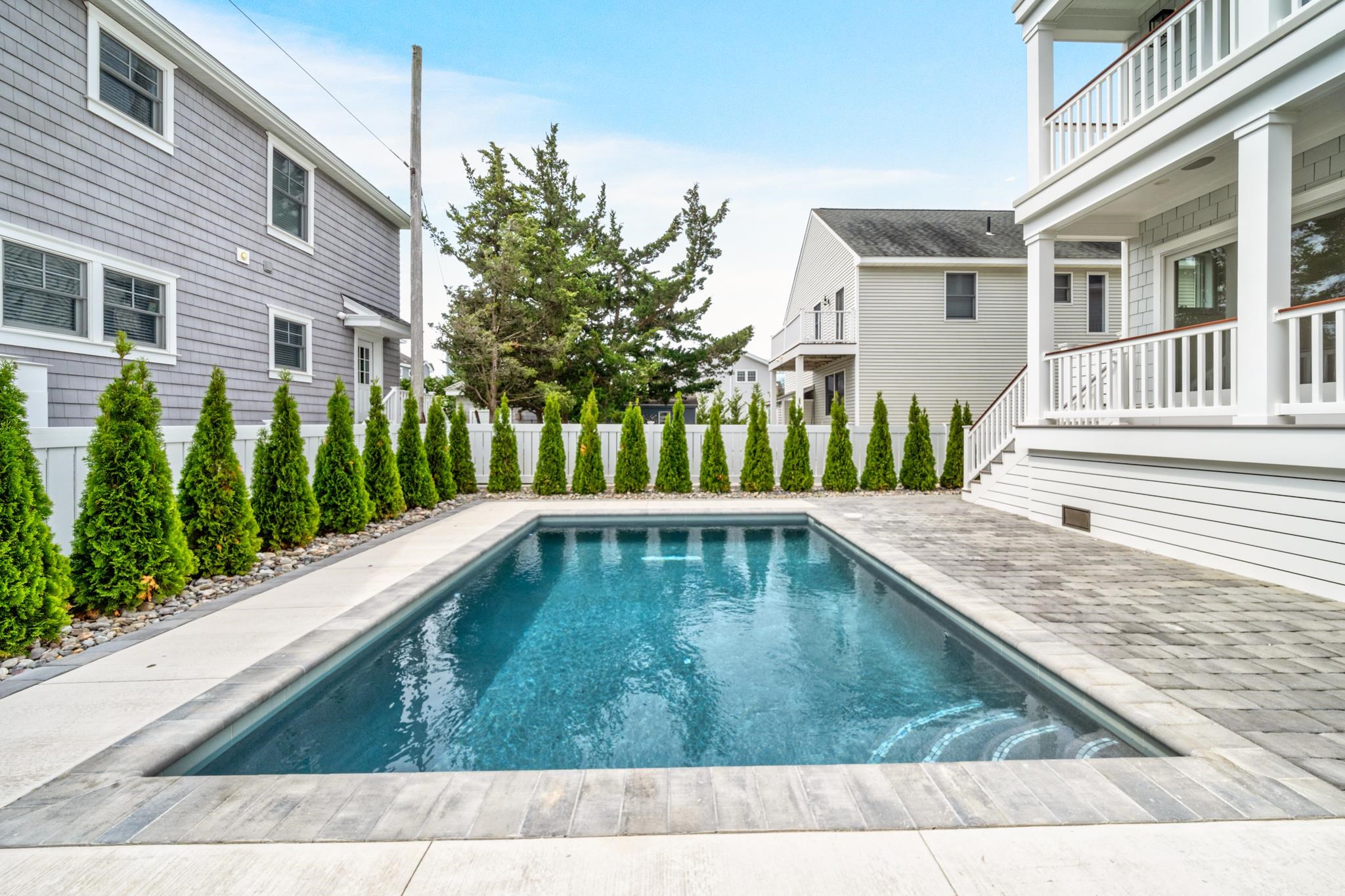 188 34th Street Avalon, NJ 08202 - Photo 10 of 47 a view of a house with a swimming pool