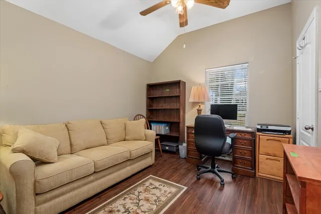 a work room with furniture and wooden floor